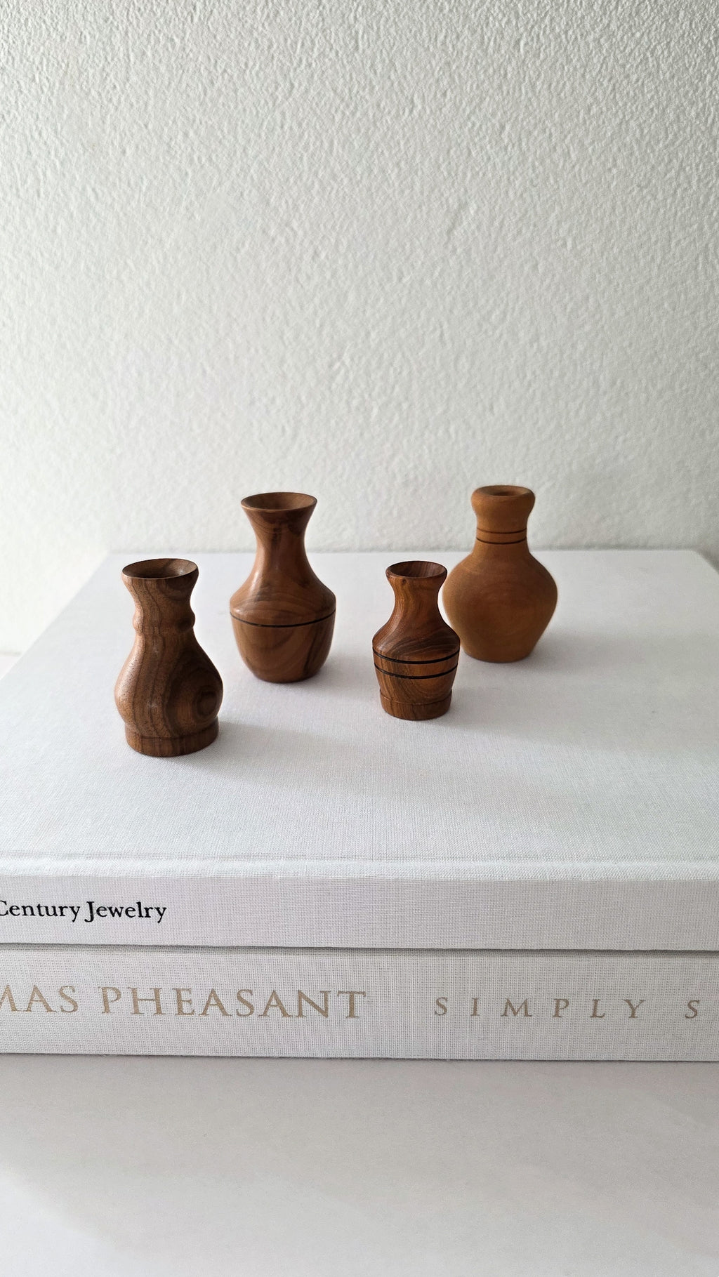 Set of four NZ wood turned miniature vases