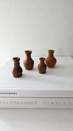 Set of four NZ wood turned miniature vases