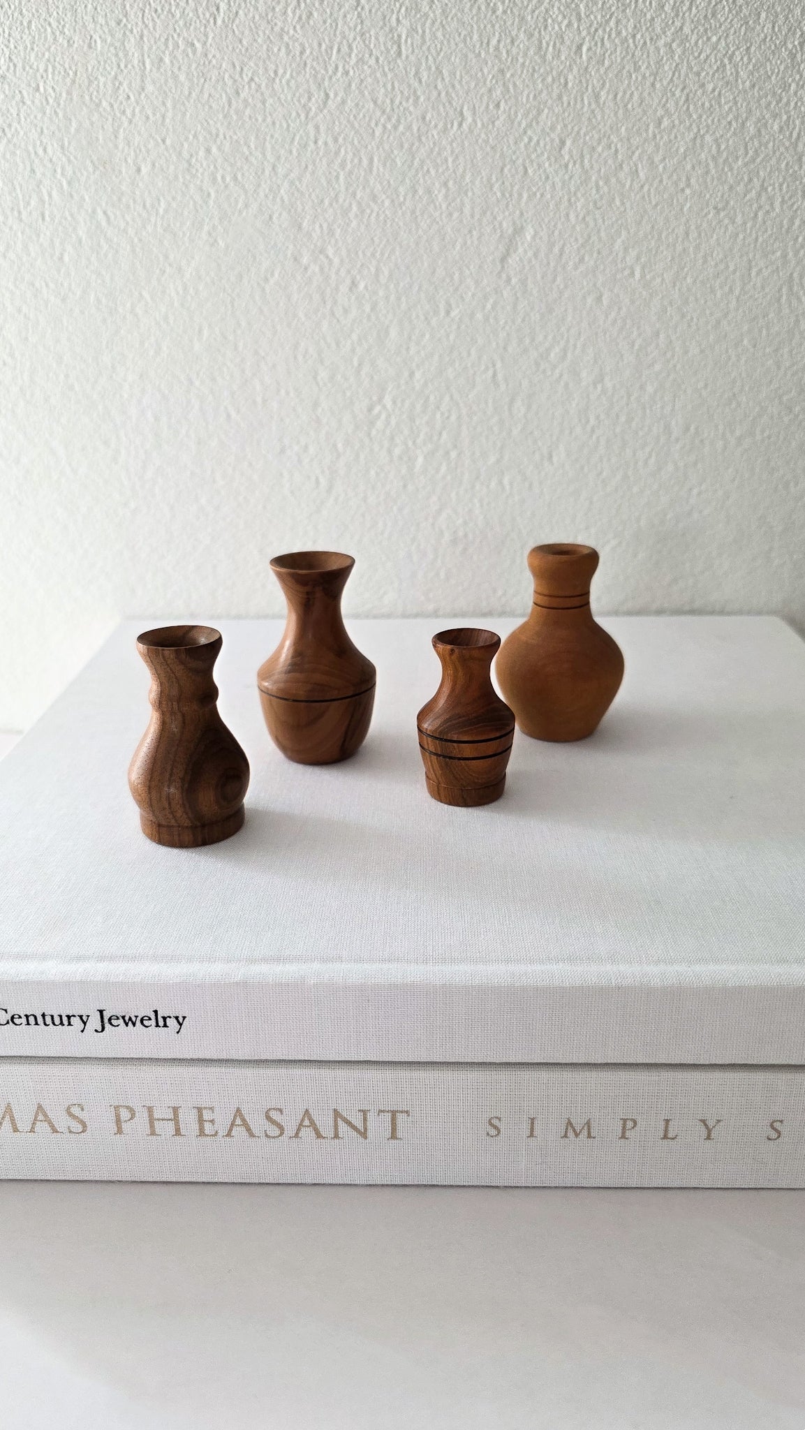 Set of four NZ wood turned miniature vases