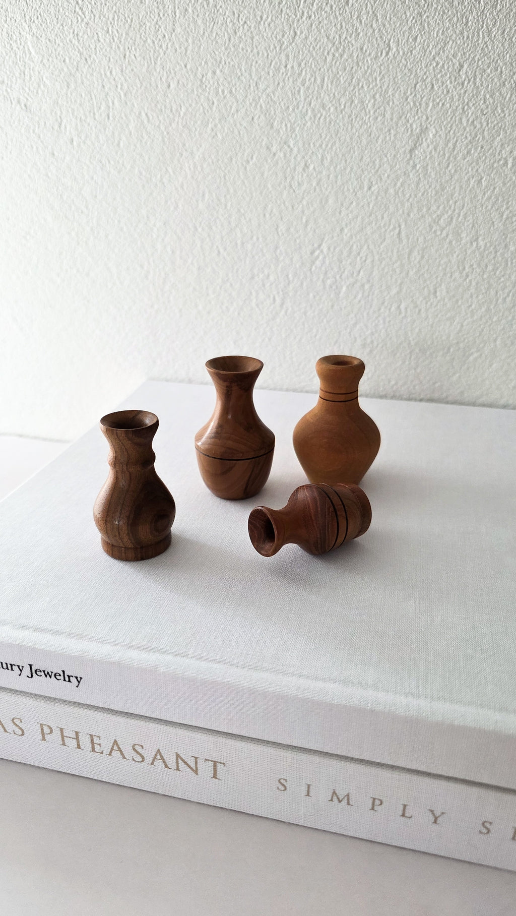 Set of four NZ wood turned miniature vases