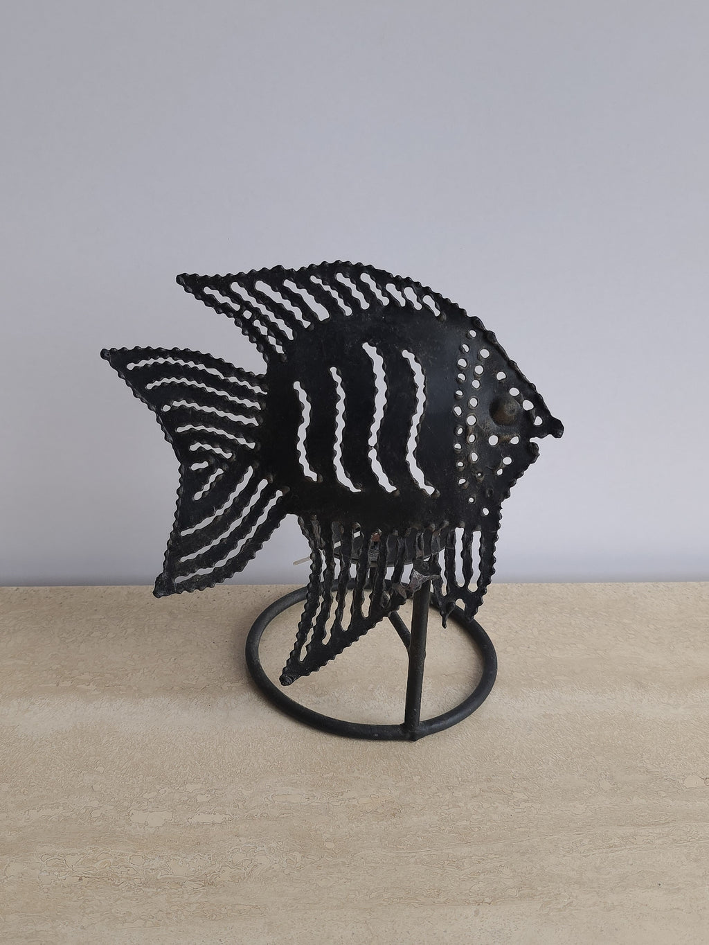 Sculptural metal fish tealight holder