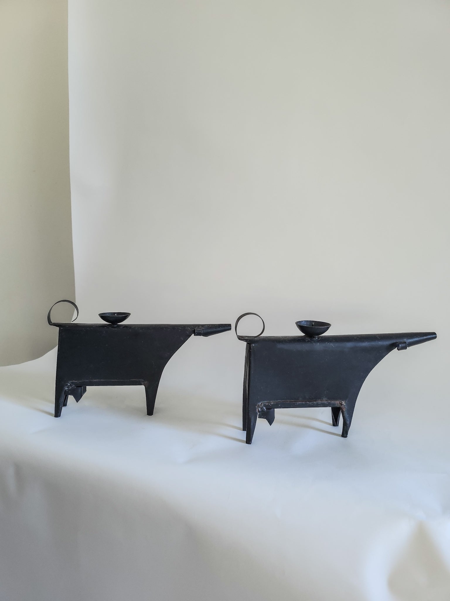 Sculptural metal cow candle holders