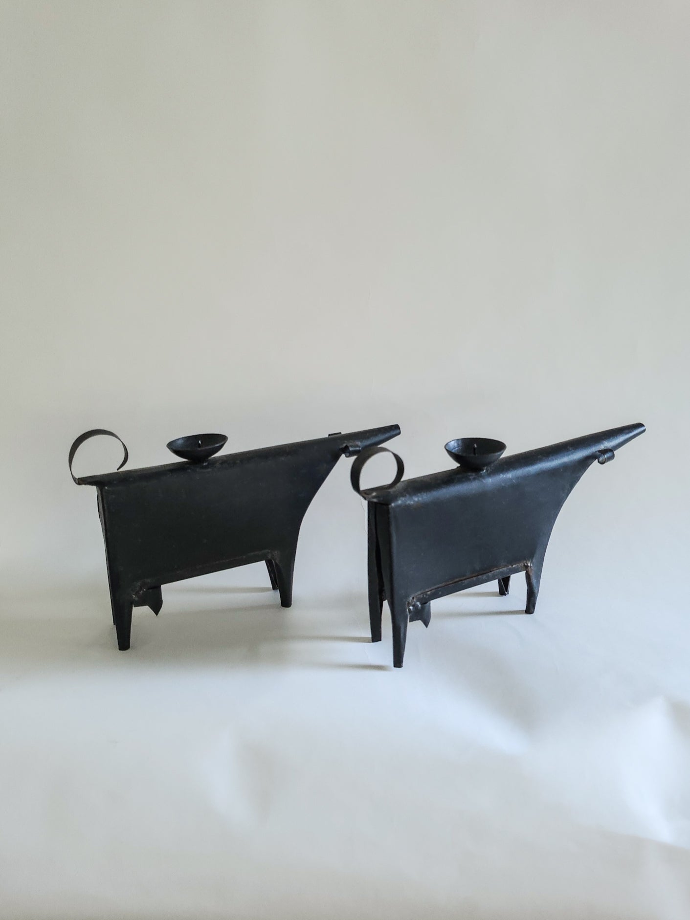 Sculptural metal cow candle holders